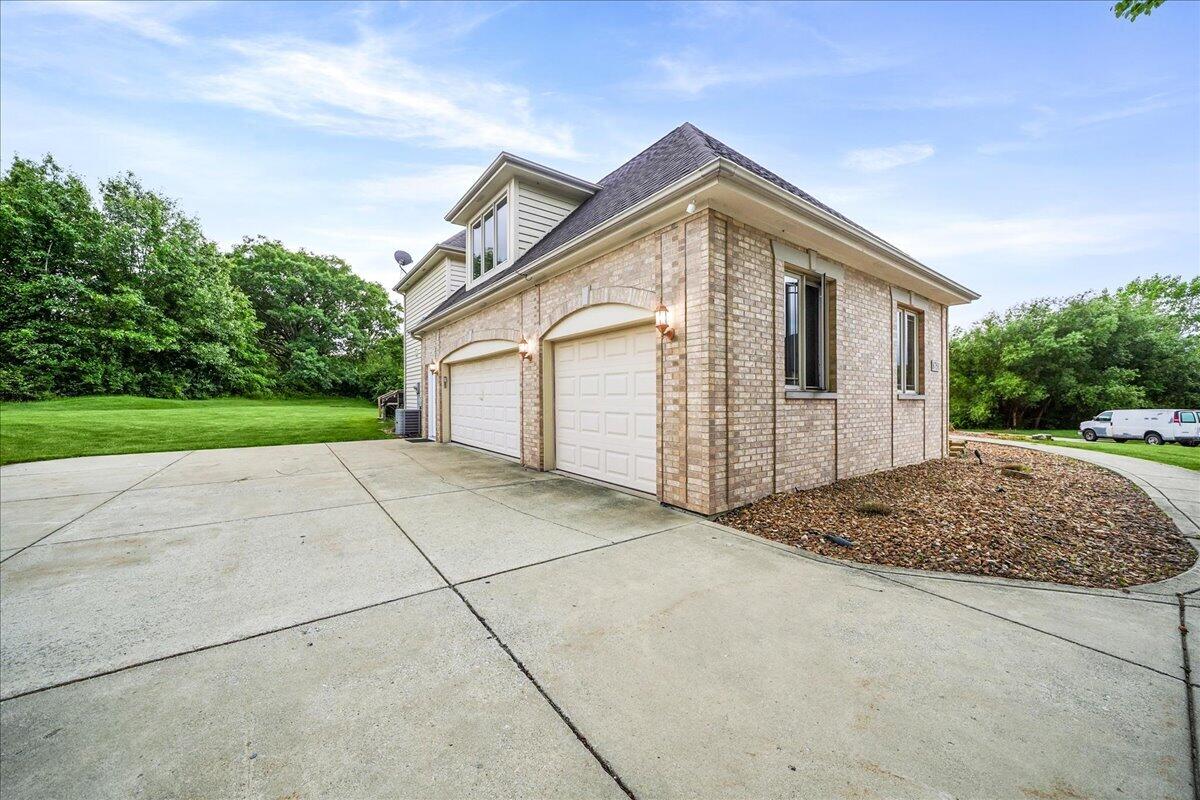 8751 Bridgewater Court Crown Point, IN 46307 - Photo 15 of 49 a front view of a house with a yard