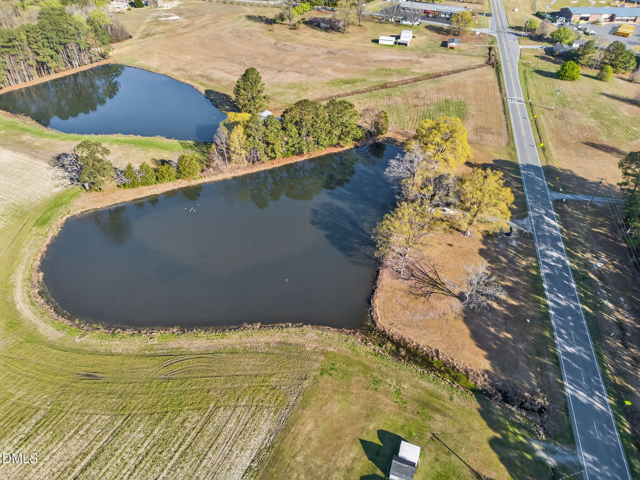 10167 Highway 50 Angier, NC 27501 - Photo 13 of 17 a view of a swimming pool with a yard