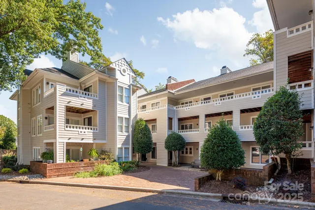 a front view of a building with garden
