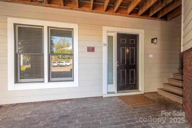 a view of a house with a door and wooden floor