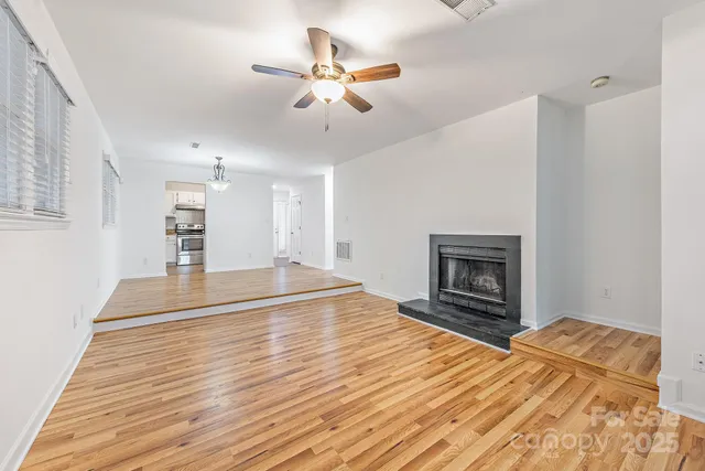 a bedroom with a bed and a fireplace