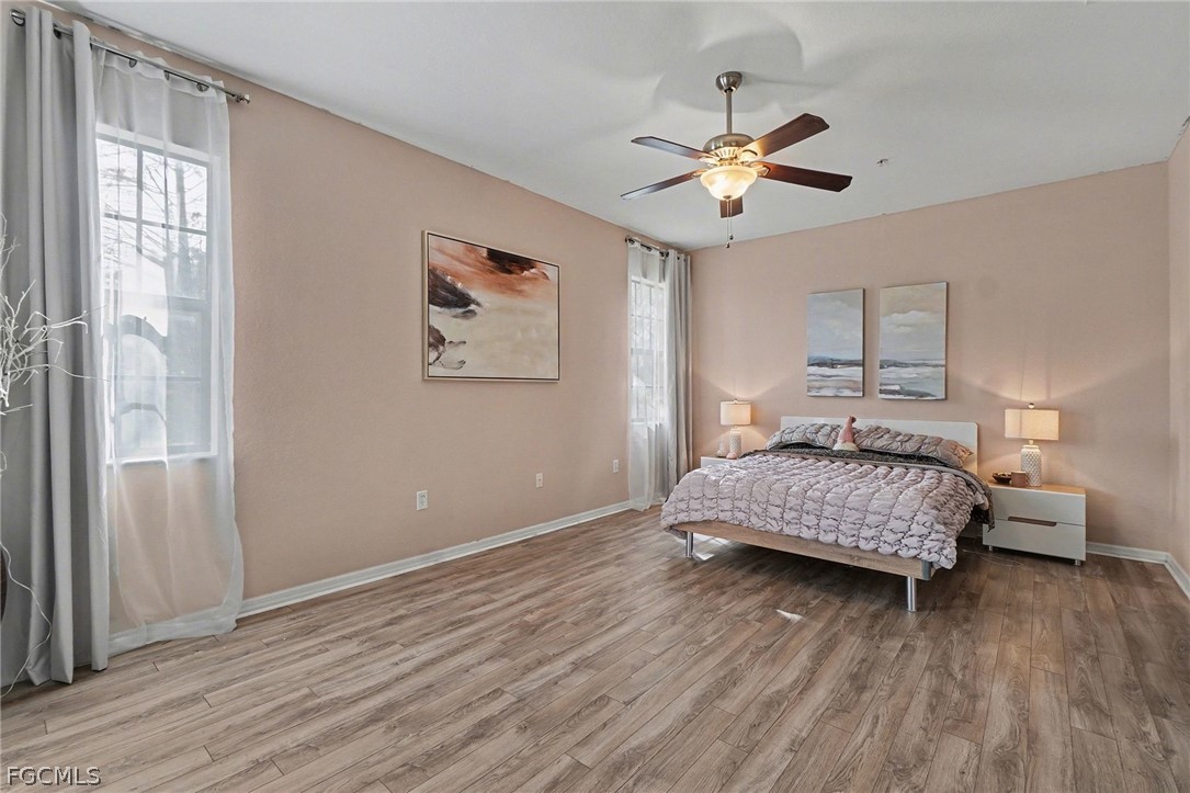 3799 Costa Maya Way, Unit 101 Estero, FL 33928 - Photo 16 of 35 a bedroom with a bed and a window