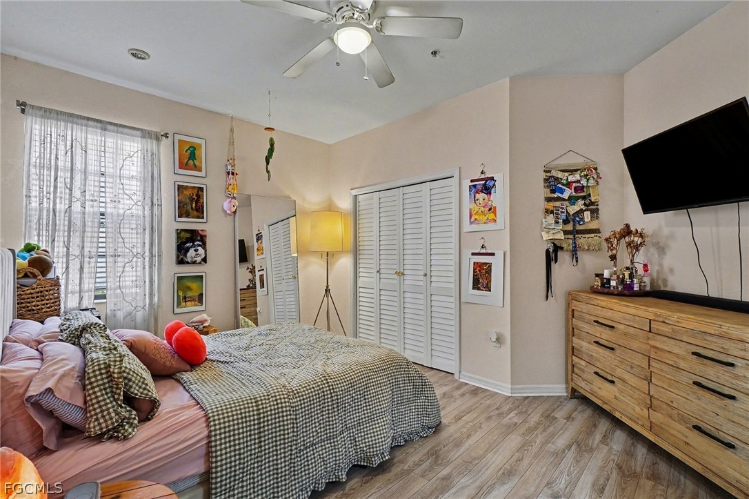 3799 Costa Maya Way, Unit 101 Estero, FL 33928 - Photo 23 of 35 a bedroom with a bed and a flat screen tv