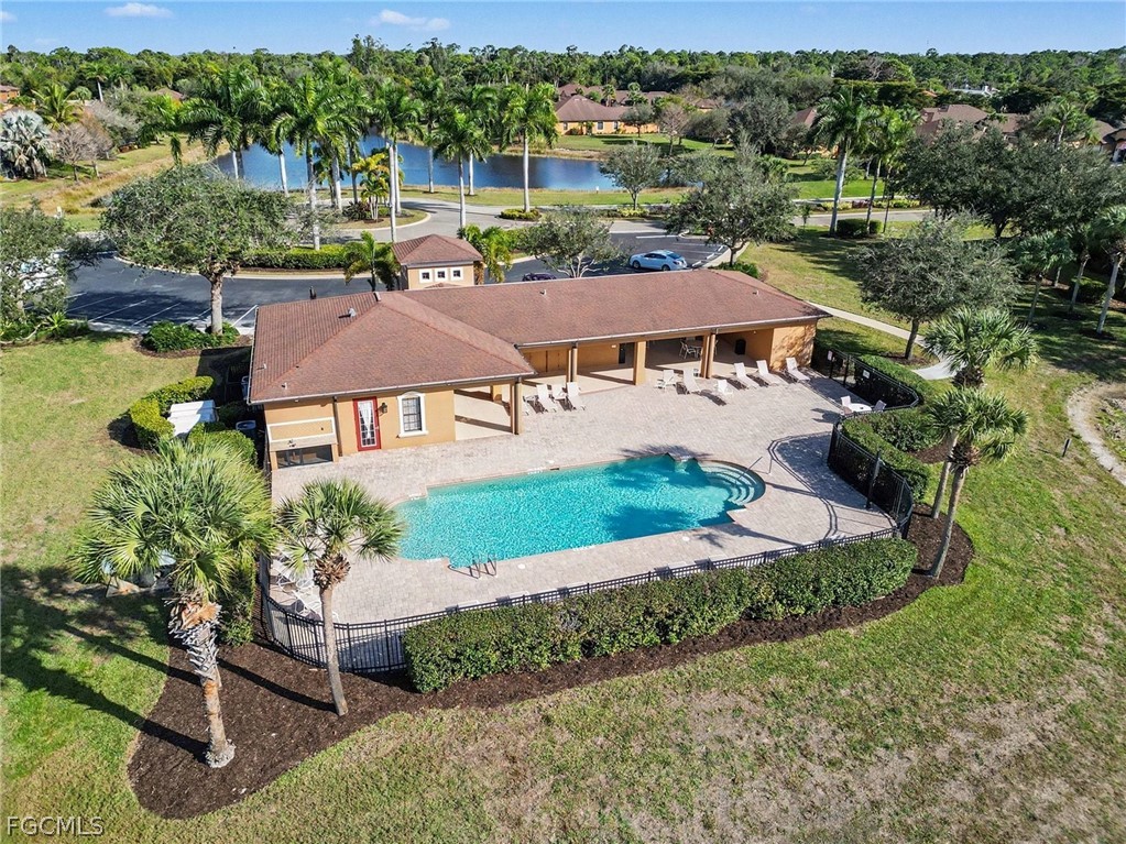 3799 Costa Maya Way, Unit 101 Estero, FL 33928 - Photo 26 of 35 an aerial view of multiple houses with a yard