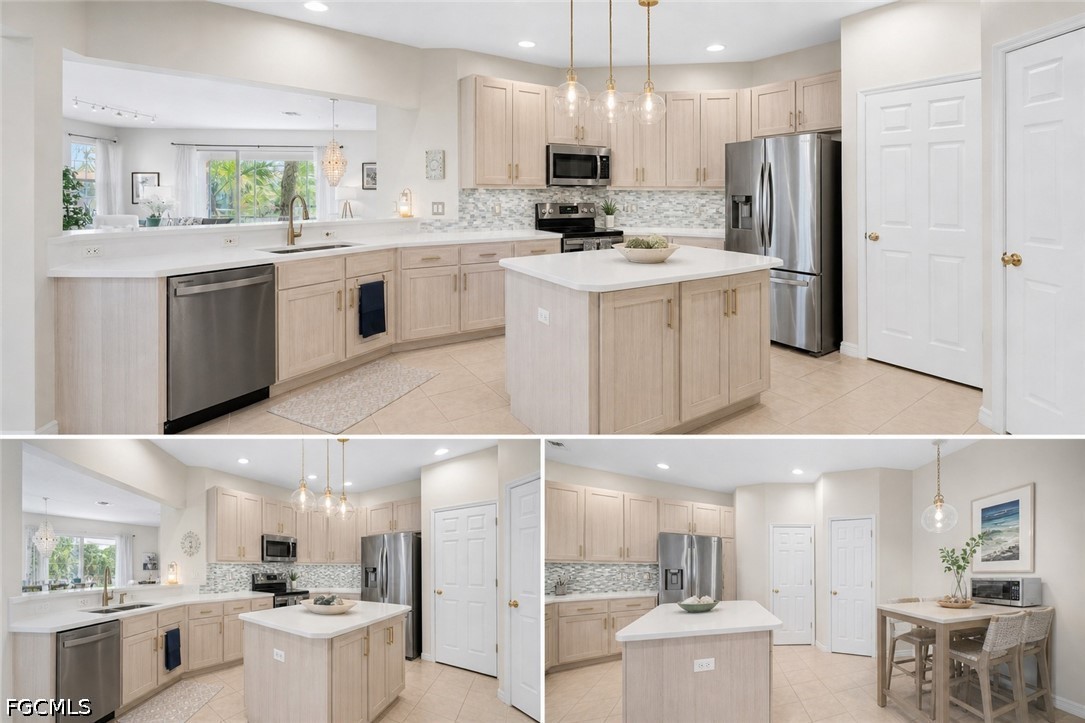 3799 Costa Maya Way, Unit 101 Estero, FL 33928 - Photo 29 of 35 a kitchen with white cabinets and stainless steel appliances