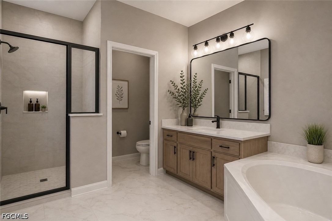 3799 Costa Maya Way, Unit 101 Estero, FL 33928 - Photo 33 of 35 a bathroom with a double vanity sink mirror and toilet