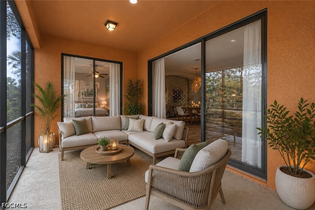3799 Costa Maya Way, Unit 101 Estero, FL 33928 - Photo 35 of 35 a living room with furniture and a large window