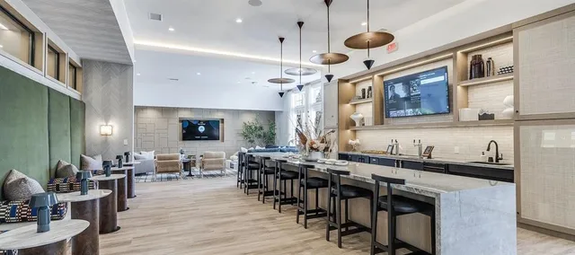 a view of a dining area with furniture window and wooden floor