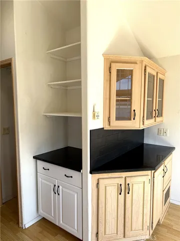 a black and white kitchen with a black white stove