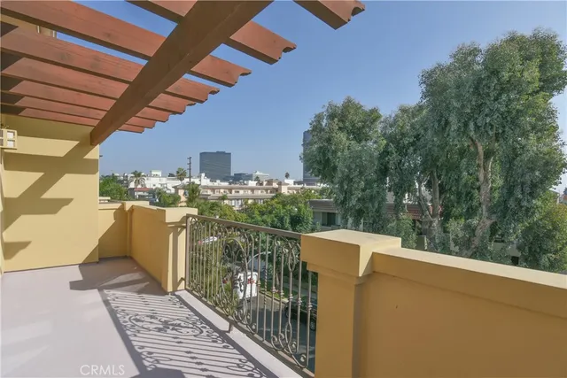 a balcony with table and chairs