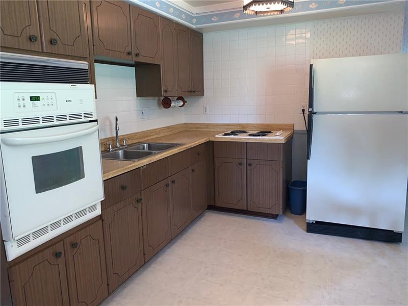 204 Reed Street Lower Burrell, PA 15068 - Photo 12 of 22 Built in electric oven and electric cooktop in kitchen.