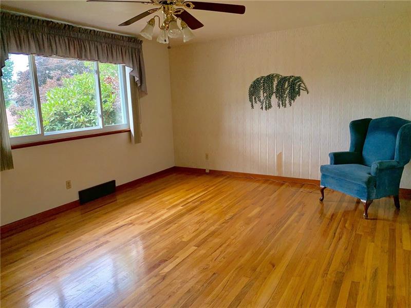 204 Reed Street Lower Burrell, PA 15068 - Photo 9 of 22 Hardwood floors are in excellent condition and have recently been exposed from many years ago.