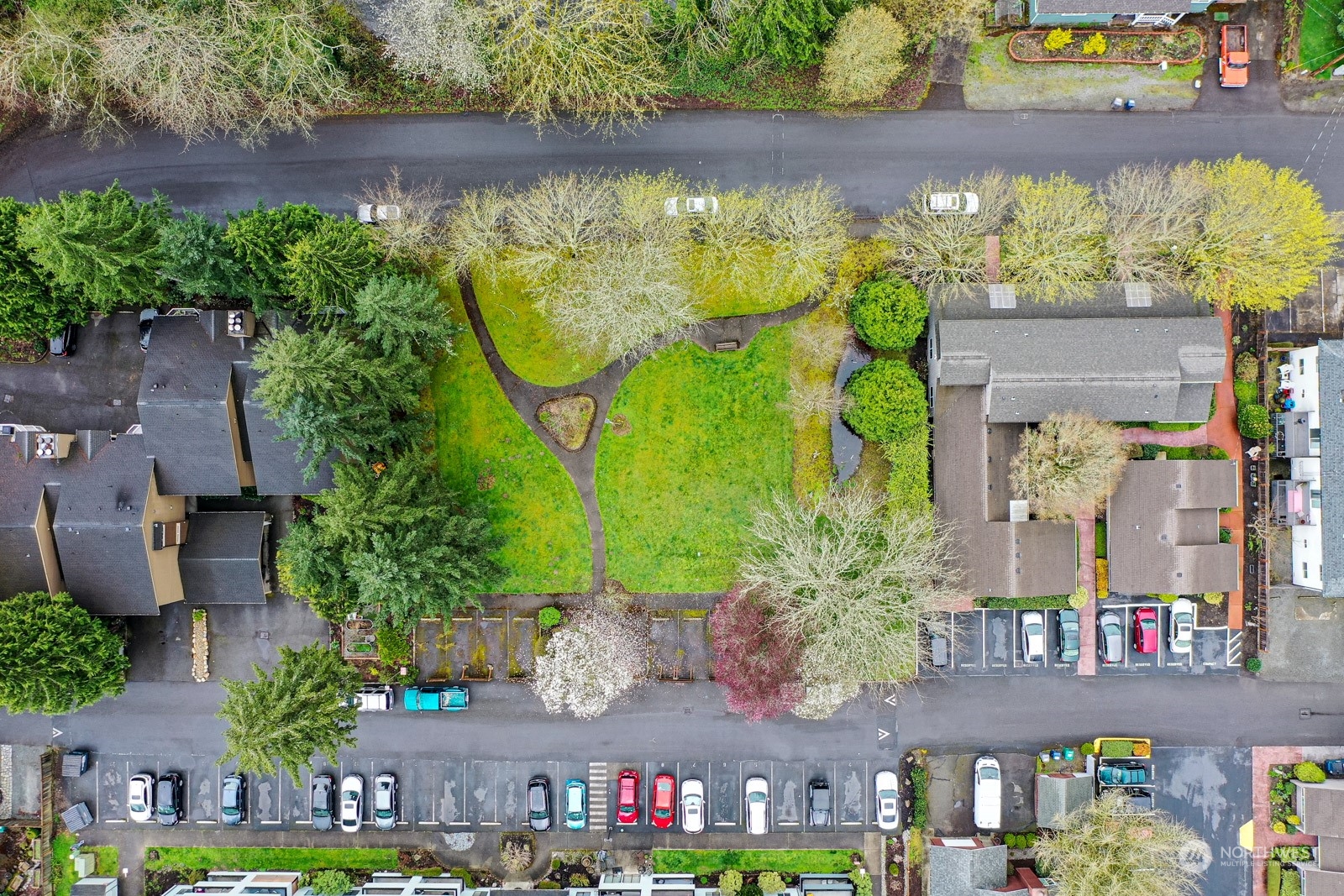 750 3rd Avenue Northwest Issaquah, WA 98027 - Photo 16 of 19 an aerial view of a residential apartment building with a yard and large trees