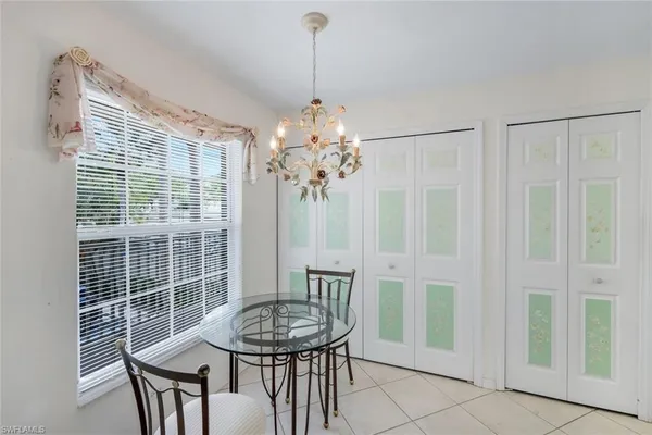 a dining room with furniture and window