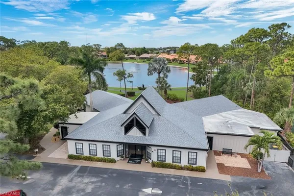 an aerial view of a house with a big yard