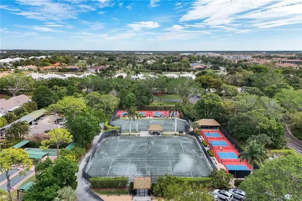 an aerial view of residential houses with outdoor space