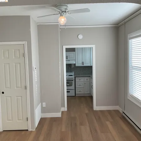 wooden floor in an empty room and a window