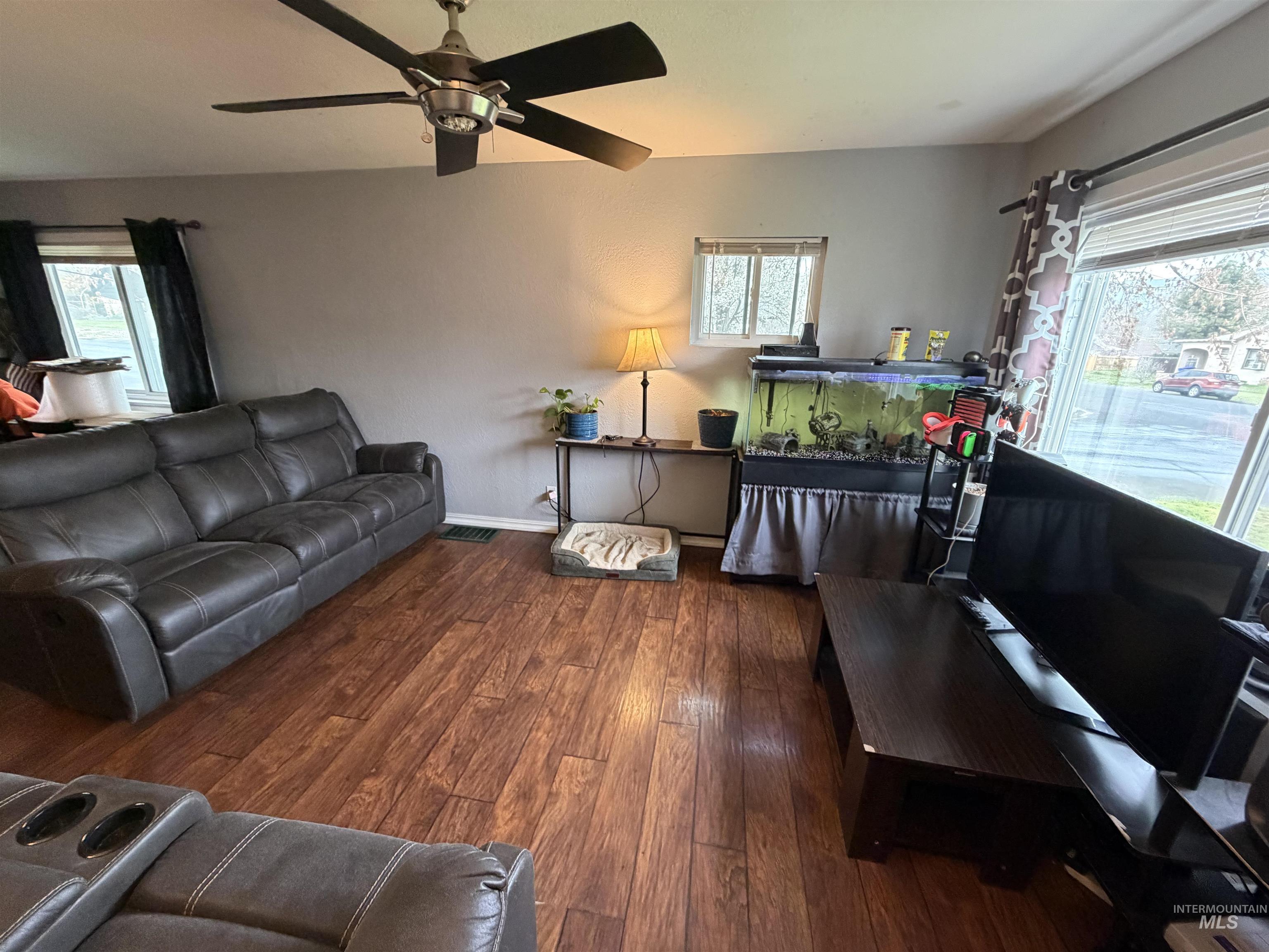 1602 14th Avenue Lewiston, ID 83501 - Photo 13 of 32 Living room with healthy amount of natural light, hardwood / wood-style flooring, and a ceiling fan