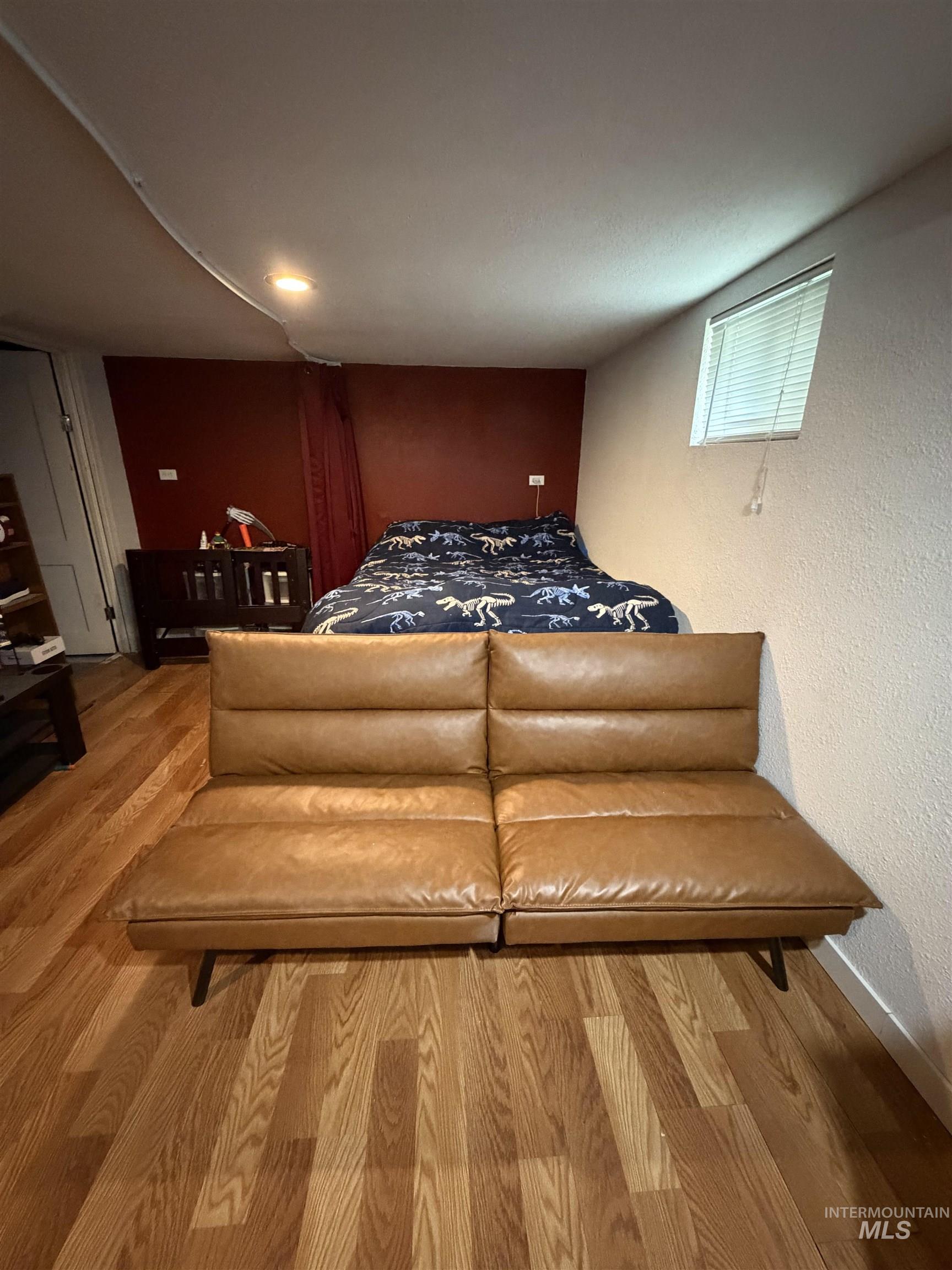 1602 14th Avenue Lewiston, ID 83501 - Photo 24 of 32 Bedroom with wood finished floors and a textured wall