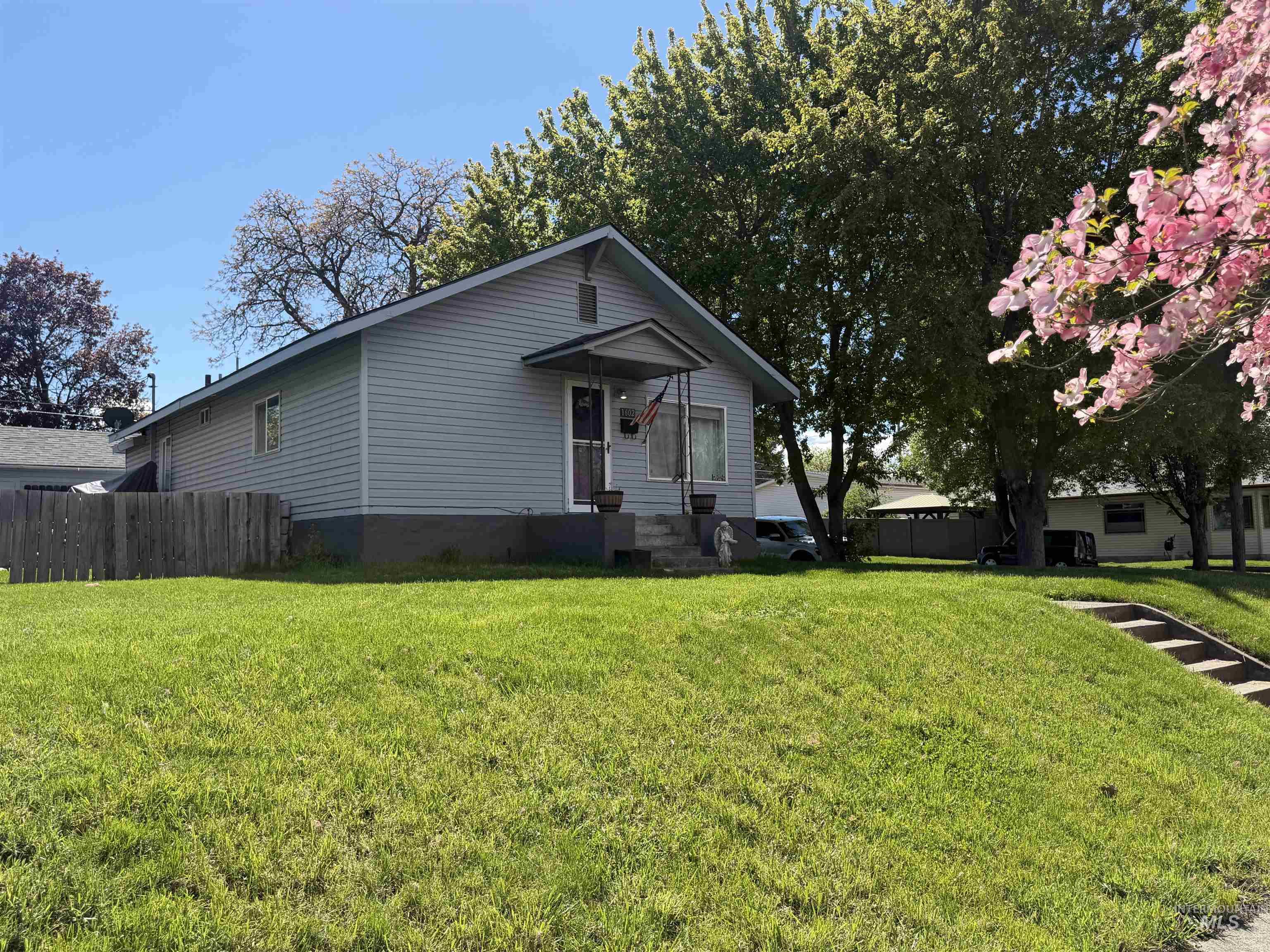1602 14th Avenue Lewiston, ID 83501 - Photo 6 of 32 Light blue siding exterior with a front porch entry and concrete steps