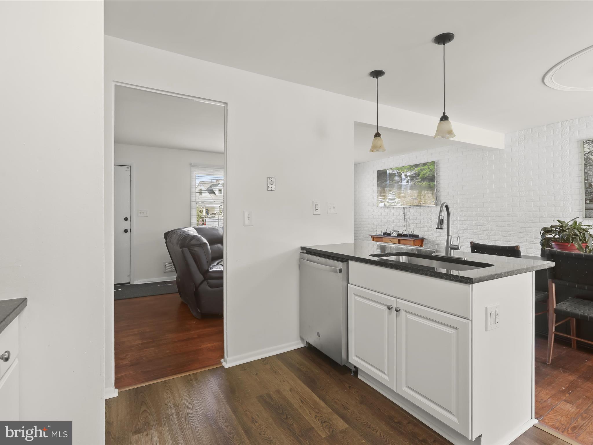 4 Ridgely Road Glen Burnie, MD 21061 - Photo 13 of 47 a kitchen with sink cabinets and stove