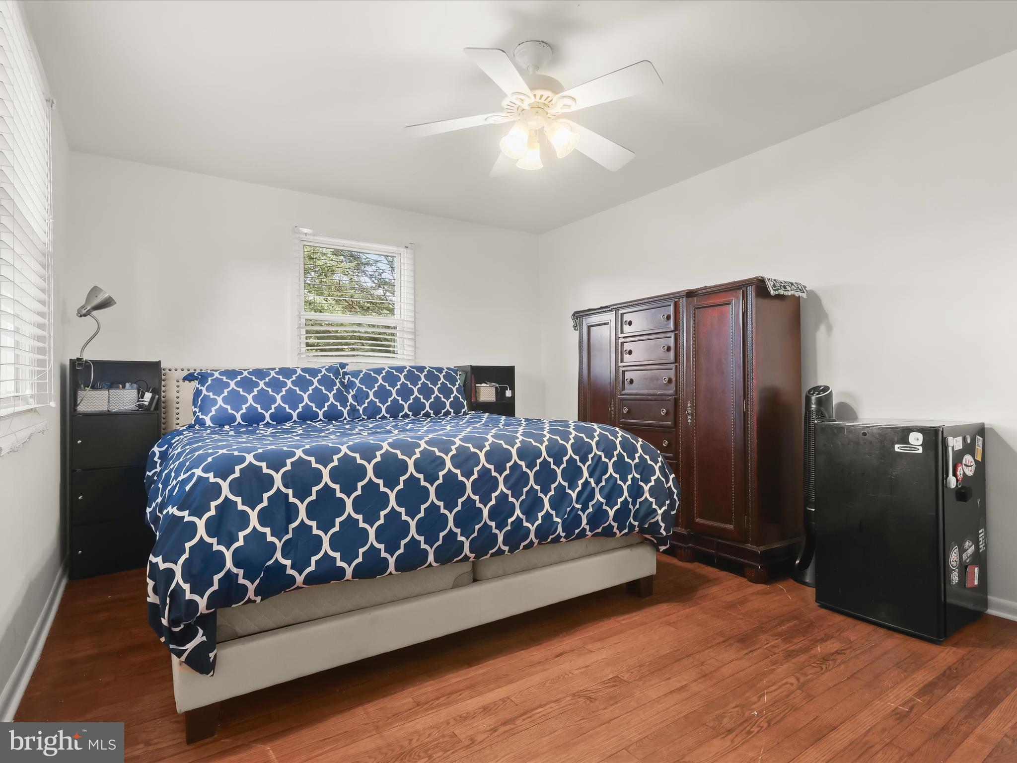 4 Ridgely Road Glen Burnie, MD 21061 - Photo 17 of 47 a bed sitting in a bedroom next to a lamp