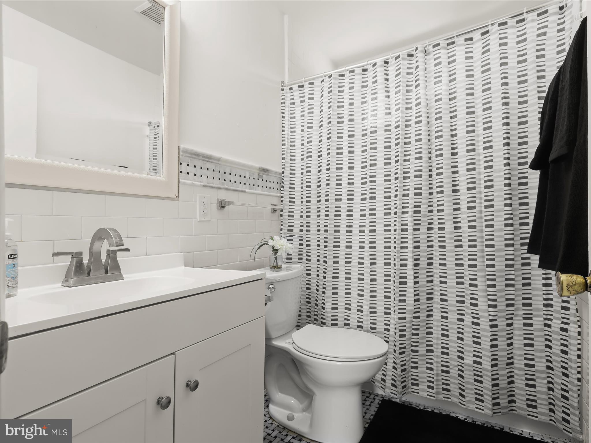 4 Ridgely Road Glen Burnie, MD 21061 - Photo 23 of 47 a bathroom with a sink a toilet and a mirror