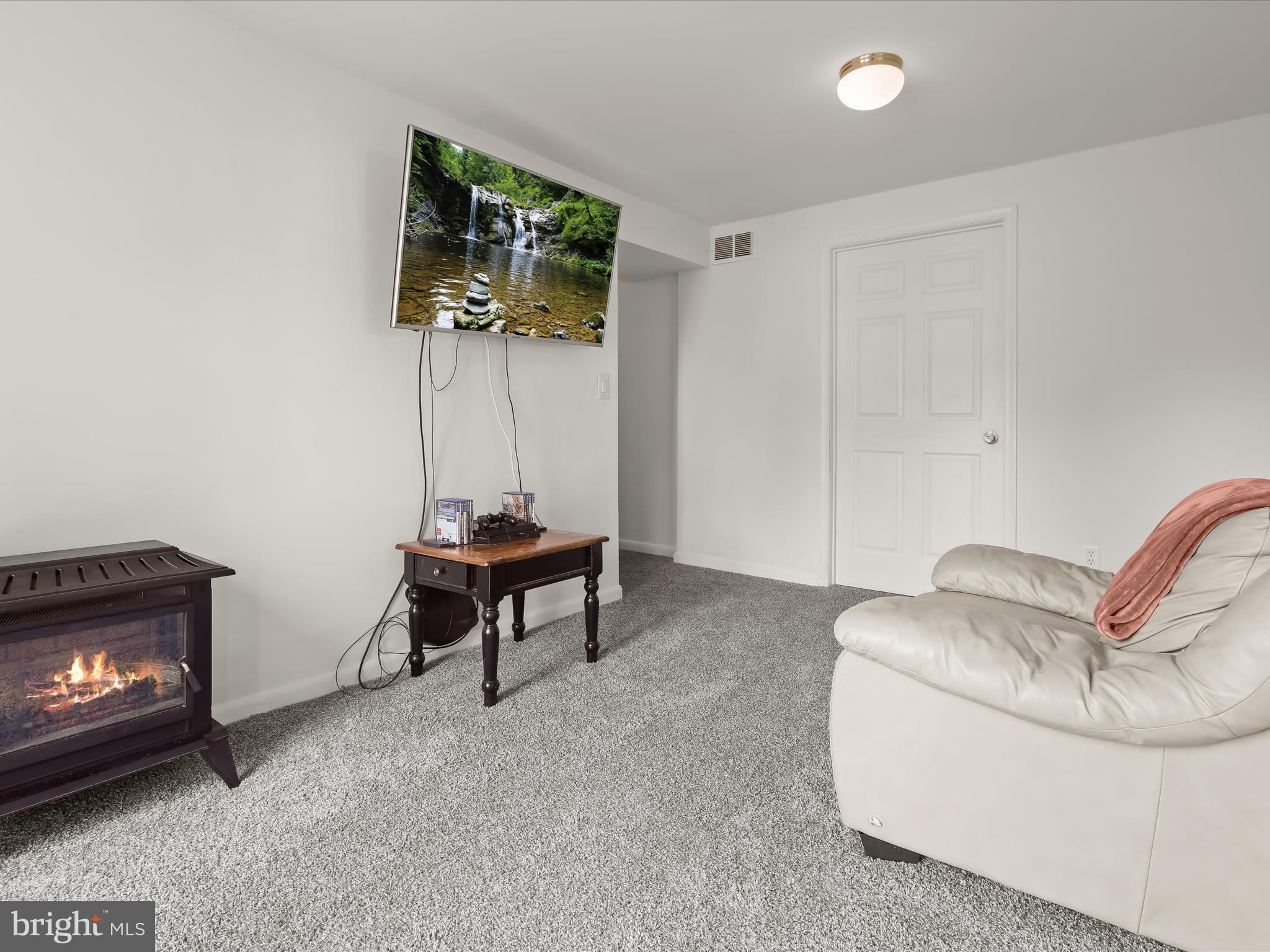 4 Ridgely Road Glen Burnie, MD 21061 - Photo 27 of 47 a living room with furniture and a fireplace