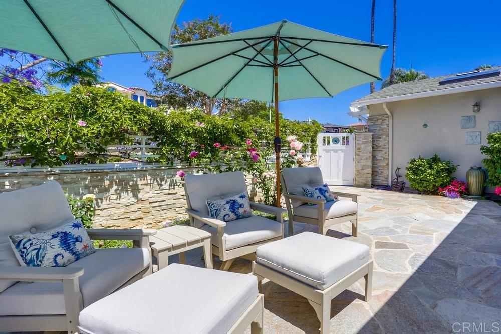 653 Marsolan Avenue Solana Beach, CA 92075 - Photo 4 of 29 a view of a patio with furniture and a umbrella
