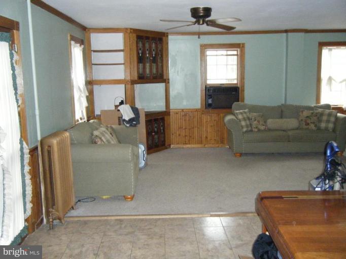 208 West Maple Road Linthicum Heights, MD 21090 - Photo 3 of 19 a living room with furniture and a window