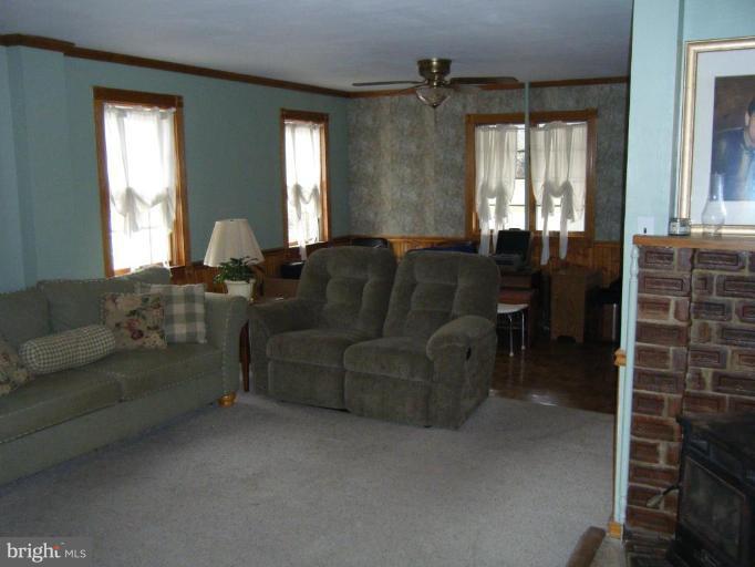 208 West Maple Road Linthicum Heights, MD 21090 - Photo 4 of 19 a living room with furniture and a window