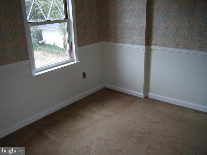 208 West Maple Road Linthicum Heights, MD 21090 - Photo 10 of 19 an empty room with a window