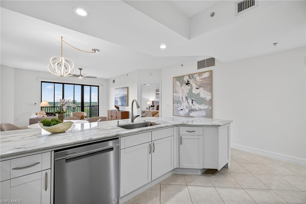 14380 Riva Del Lago Drive, Unit 802 Fort Myers, FL 33907 - Photo 13 of 49 a kitchen with a sink and cabinets