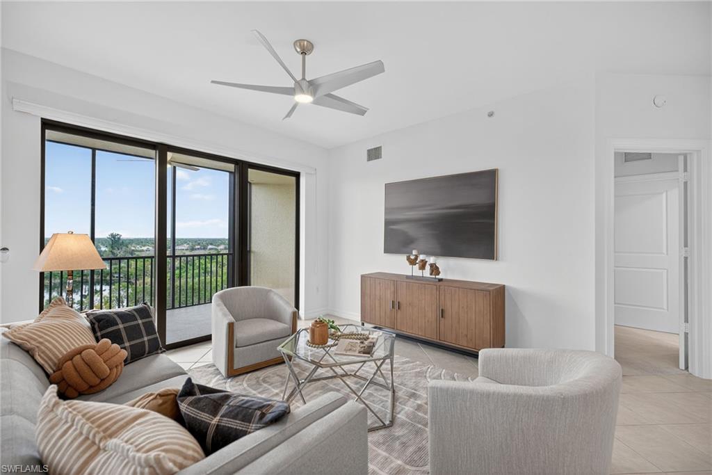 14380 Riva Del Lago Drive, Unit 802 Fort Myers, FL 33907 - Photo 14 of 49 a living room with furniture and a flat screen tv
