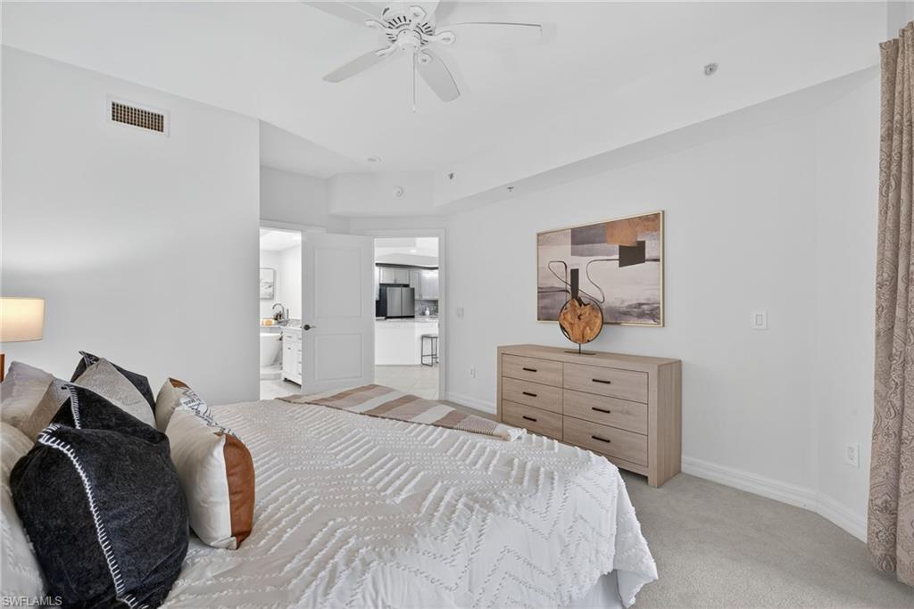 14380 Riva Del Lago Drive, Unit 802 Fort Myers, FL 33907 - Photo 19 of 49 a bedroom with a bed and wooden floor