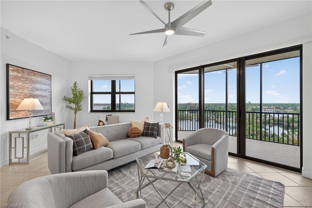 14380 Riva Del Lago Drive, Unit 802 Fort Myers, FL 33907 - Photo 2 of 49 a living room with furniture and a large window