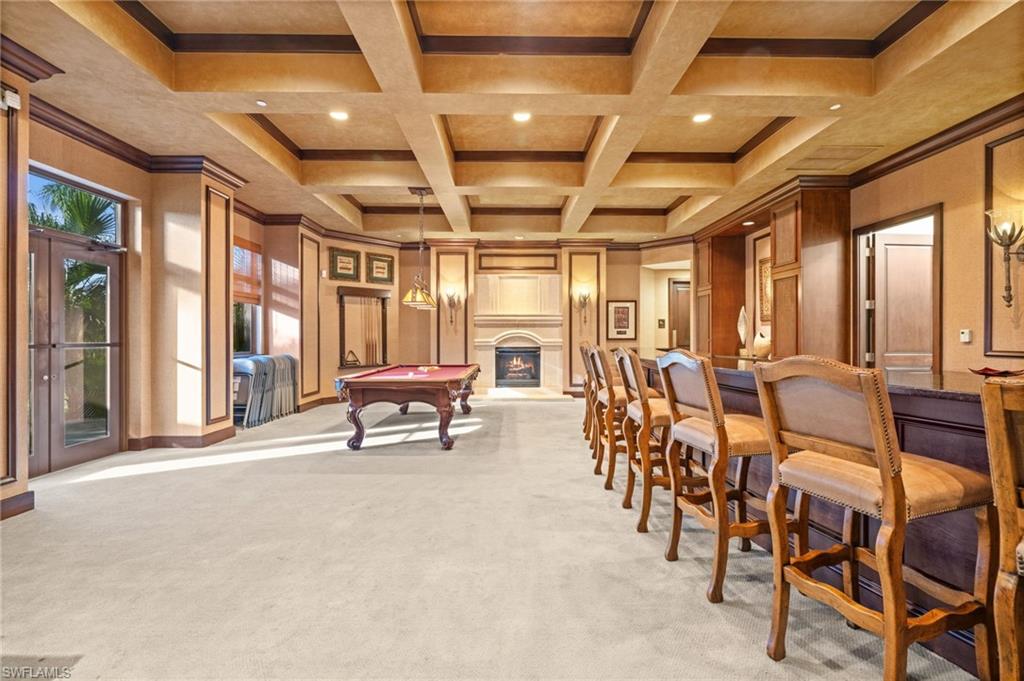 14380 Riva Del Lago Drive, Unit 802 Fort Myers, FL 33907 - Photo 33 of 49 a living room with lots of chairs and a chandelier