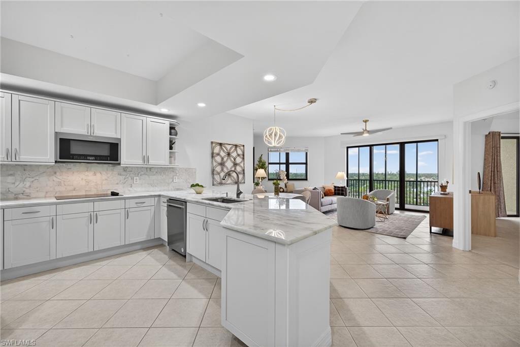 14380 Riva Del Lago Drive, Unit 802 Fort Myers, FL 33907 - Photo 10 of 49 a large white kitchen with cabinets