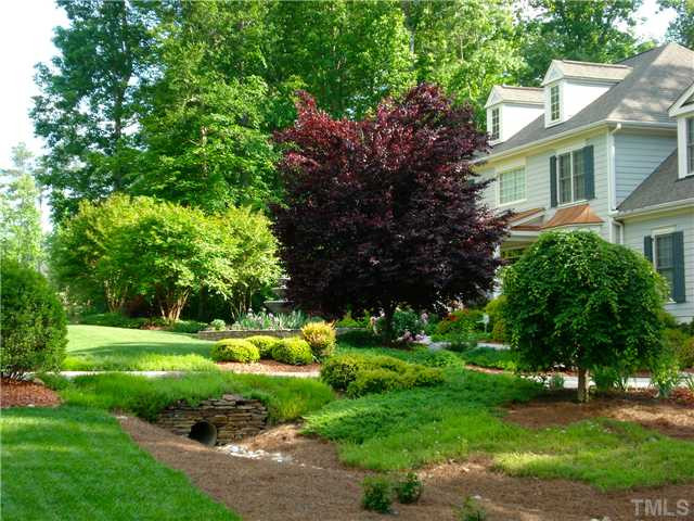 8677 Barrett Ridge Road Wake Forest, NC 27587 - Photo 22 of 25 This is how colorful and lush the landscaping will look soon! Yard
