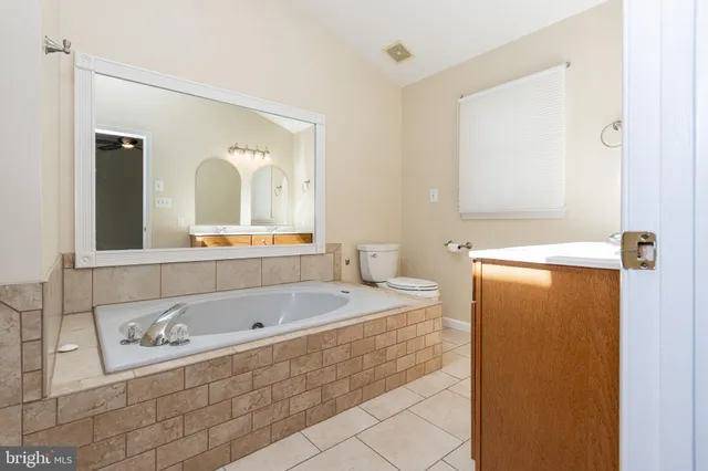a bathroom with a bathtub and a sink