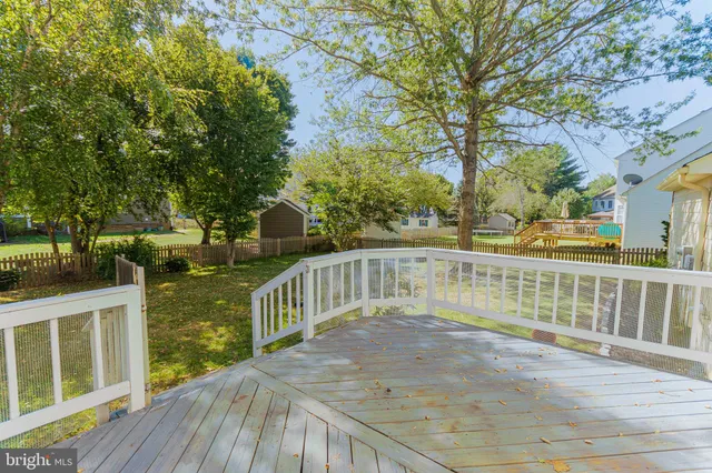 a view of a balcony with wooden floor