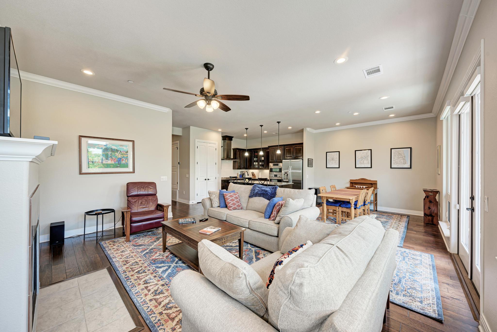 2601 North Quinlan Park Road, Unit 506 Austin, TX 78732 - Photo 10 of 39 An open-concept living space with hardwood flooring and high ceilings creates an inviting atmosphere.