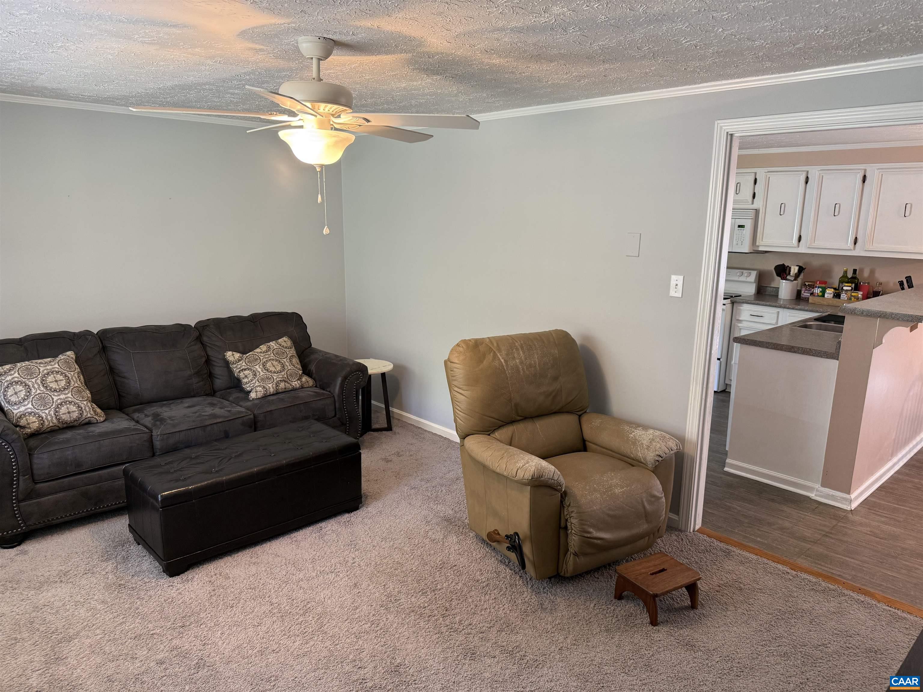 2002 Oliver Creek Road Troy, VA 22974 - Photo 4 of 38 a living room with furniture and a chandelier