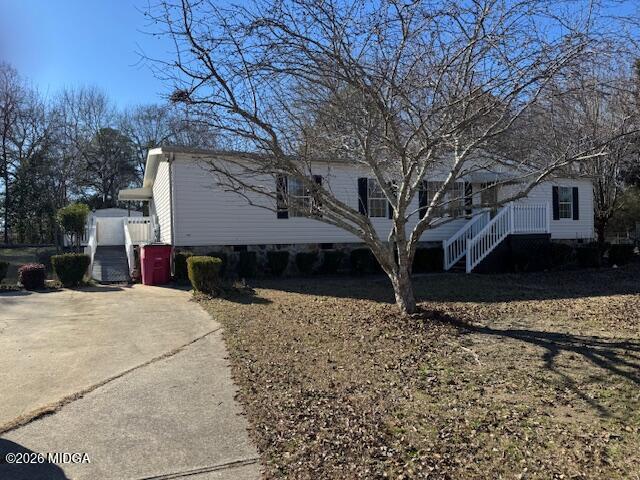 a house that has tree in front of it