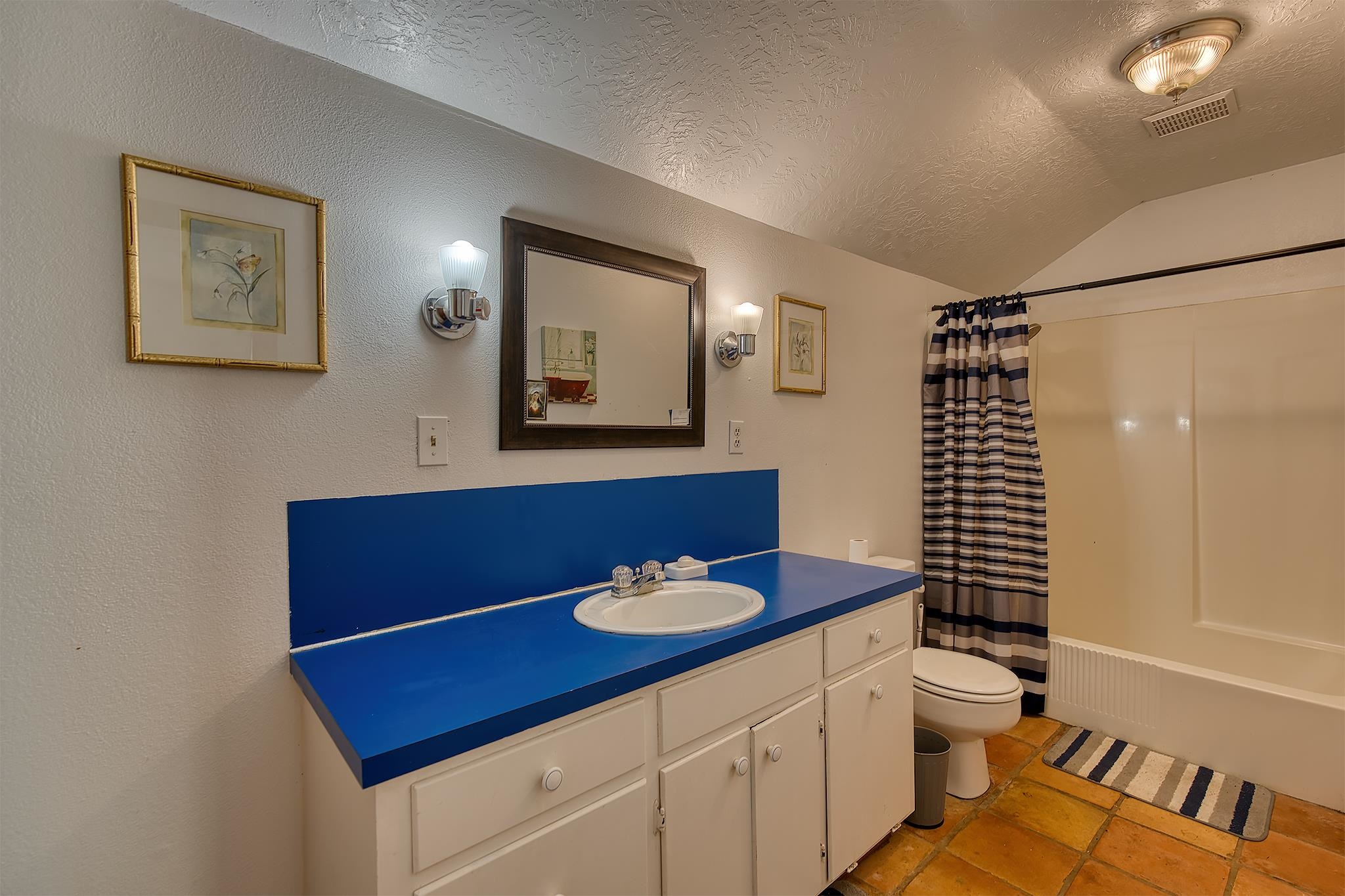 7476 Foard Road Beaumont, TX 77705 - Photo 43 of 49 a bathroom with a sink a toilet and mirror