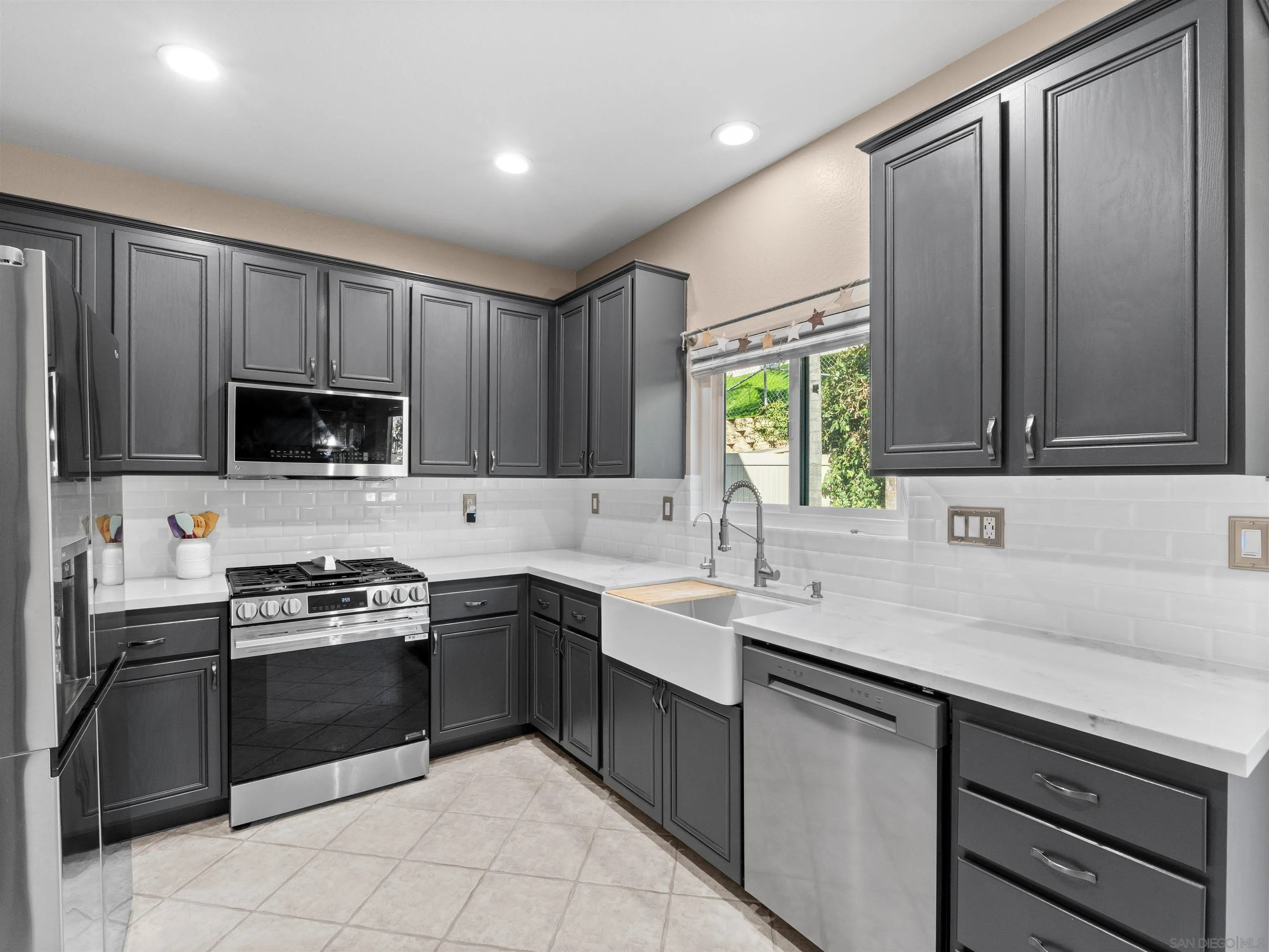 2925 Sunhaven Court Alpine, CA 91901 - Photo 5 of 19 a kitchen with a sink stove and microwave