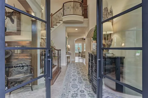 a view of a hallway with a glass door