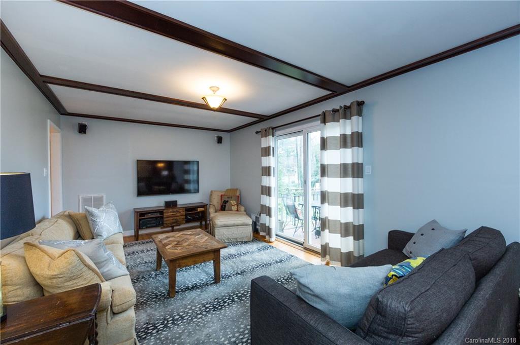 4615 Walker Road Charlotte, NC 28211 - Photo 13 of 28 a living room with furniture and a flat screen tv