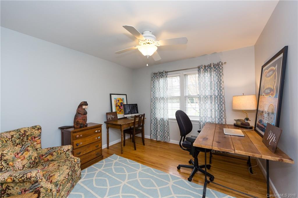 4615 Walker Road Charlotte, NC 28211 - Photo 17 of 28 a view of a workspace with furniture and a window