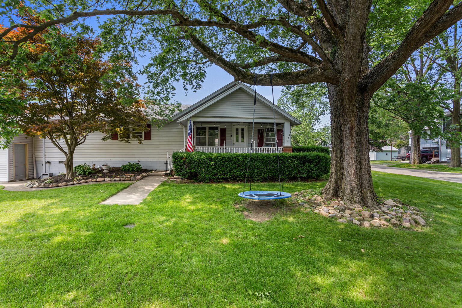 504 South West Union Street Monticello, IL 61856 - Photo 2 of 35 a view of a house with a yard and large trees